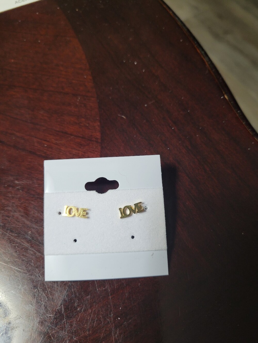 Acero "LOVE" Gold Colored Stainless Steel earrings.